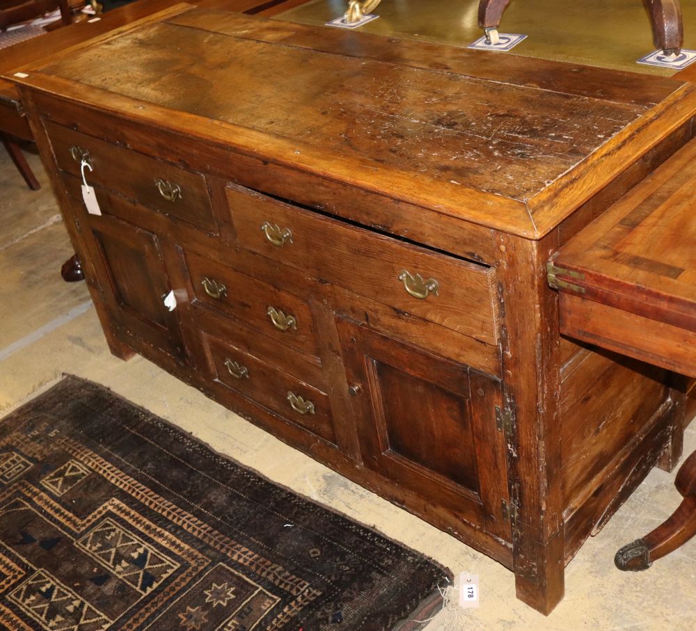 An 18th century style oak low dresser (incorporates old timber), W.142cm, D.52cm, H.78cm